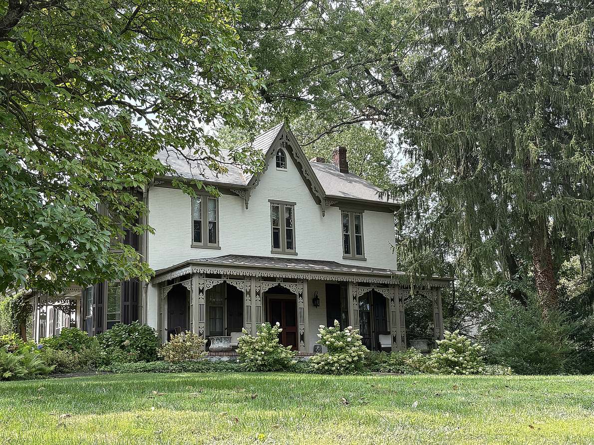 A house in the Kennett Square historic district. Deep porch, painted clapboard, and a National Register listing that changes what you may do to the outside.